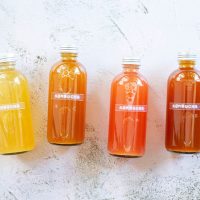 bottles of kombucha tea in different colors