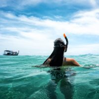 woman snorkeling in the water