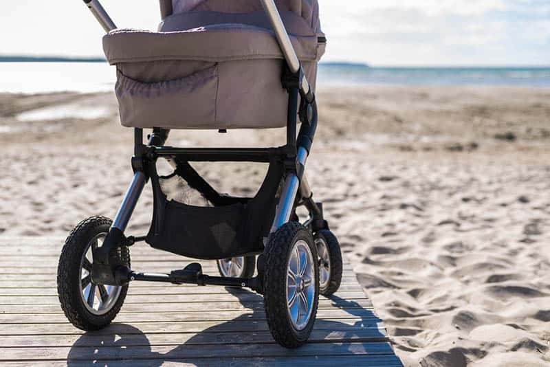 baby strollers on the beach in a sunny day