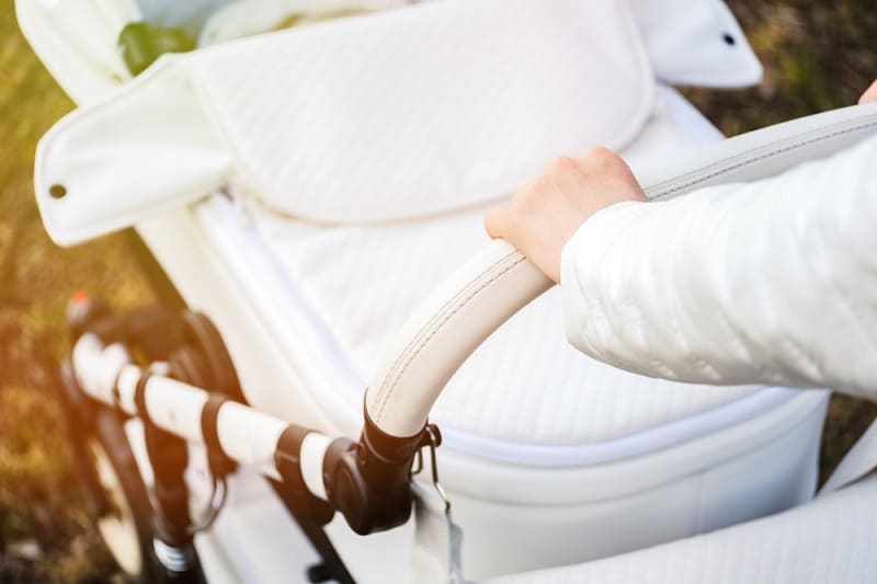 adjustable handlebar on a white stroller