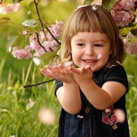 adorable little girl playing in the garden