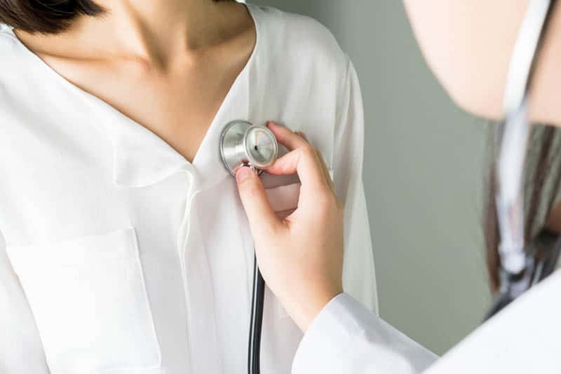 Doctor is using a stethoscope for patient examination