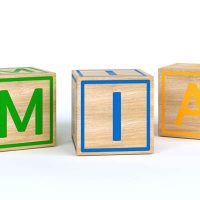 colorful toy blocks spelling out the name Mia