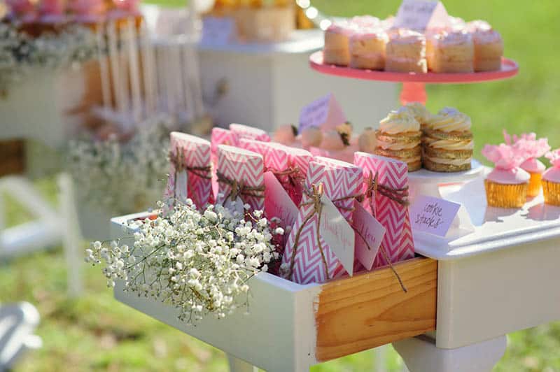 Dessert table with cakes decorated for a baby shower at farm