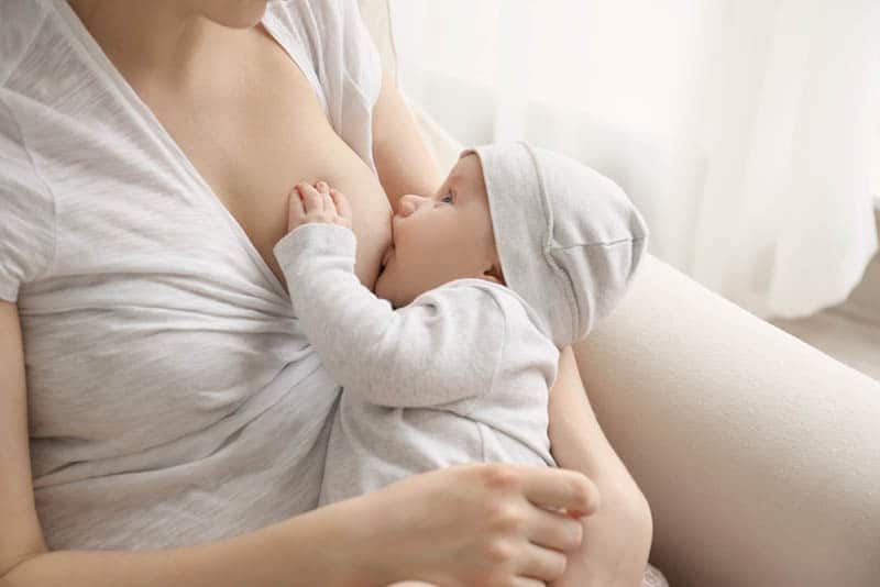 young mother breastfeeding her baby