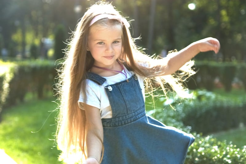 Little pretty child girl with long hair