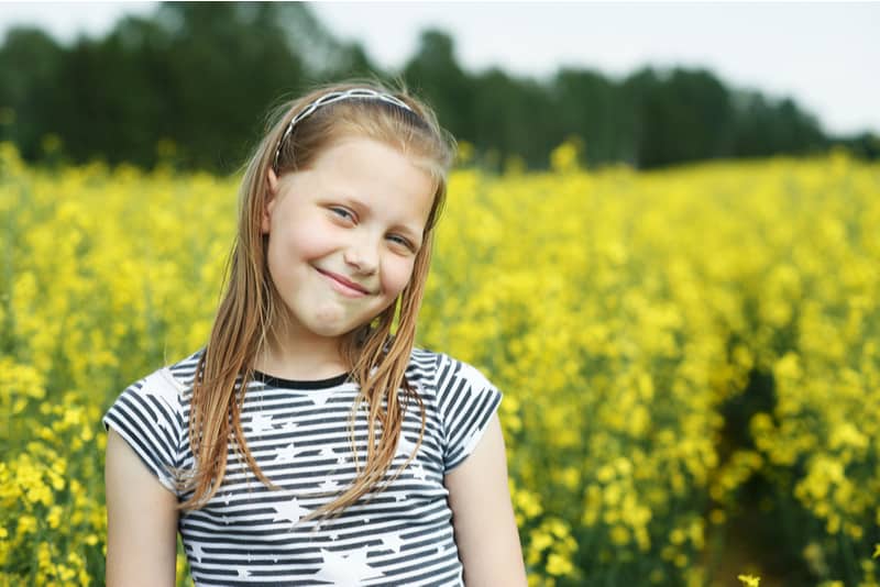  beautiful little girl in a field