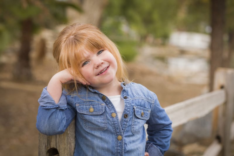 cute little girl posing outdoors