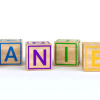 the name Daniel spelled out using colorful wooden cubes