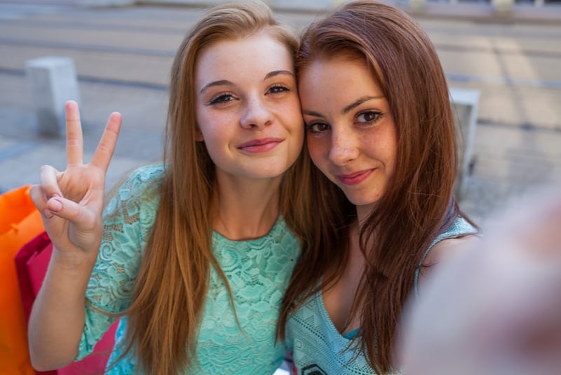 Two pretty girls taking selfie