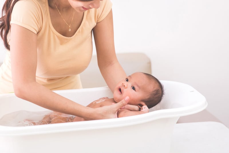 baby bath at home using a tub