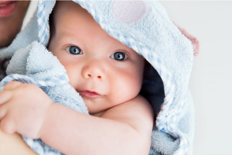 baby child after bath with towel on head