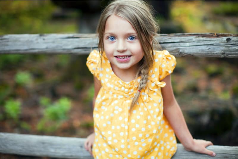 cute little girl with blue eyes outside