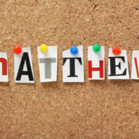 the name Matthew in colorful letters on a board