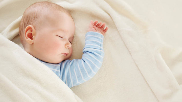 What You Should Do If Your Baby Spits Up In Sleep