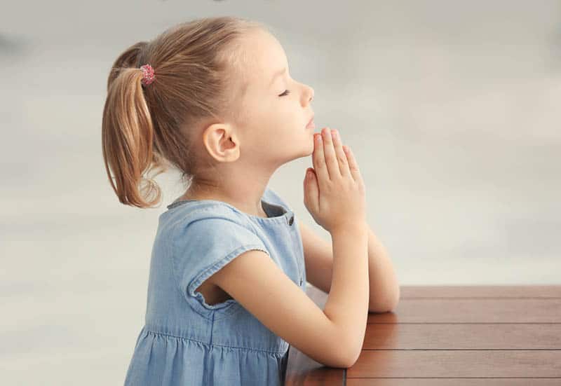 cute little girl praying
