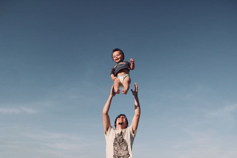 uncle throwing his nephew in the air