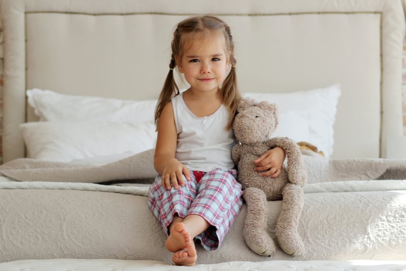 little girl with her stuffed toy